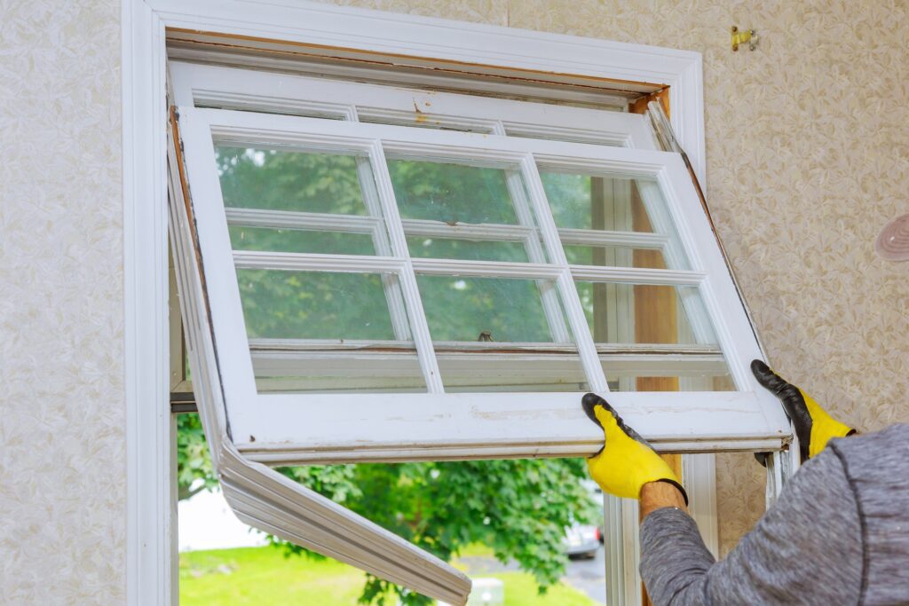 Home repairs, replacement windows. Master removes old window